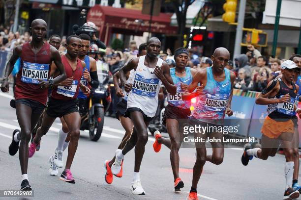 Wilson Kipsang Kiprotich, Geoffrey Kamworor, Abdihakem Abdirahman, Meb Keflezighi and Koen Naert seen running at mile 17 during the 2017 TCS New York...