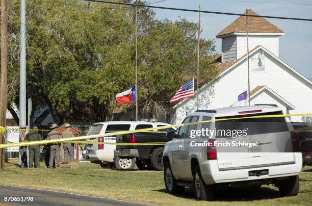 Law enforcement officials gather near the First Baptist Church following a shooting on November 5, 2017 in Sutherland Springs, Texas. At least 20...