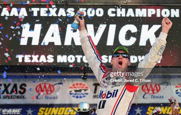 Kevin Harvick, driver of the Mobil 1 Ford, celebrates in Victory Lane after winning the Monster Energy NASCAR Cup Series AAA Texas 500 at Texas Motor...