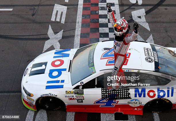 Kevin Harvick, driver of the Mobil 1 Ford, celebrates winning the Monster Energy NASCAR Cup Series AAA Texas 500 at Texas Motor Speedway on November...