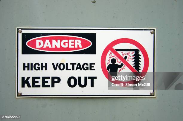 danger - high voltage - keep out sign on a power transformer - keep out sign stock pictures, royalty-free photos & images