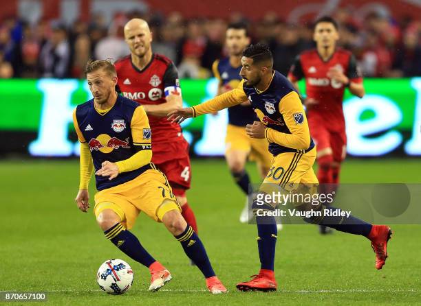 Daniel Royer of New York Red Bulls dribbles the ball along with teammate Gonzalo Veron during the second half of the MLS Eastern Conference...