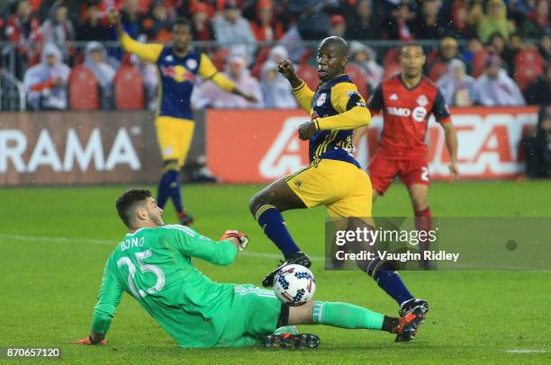 Alex Bono of Toronto FC makes a save on a shot by Bradley Wright-Phillips of New York Red Bulls during the second half of the MLS Eastern Conference...