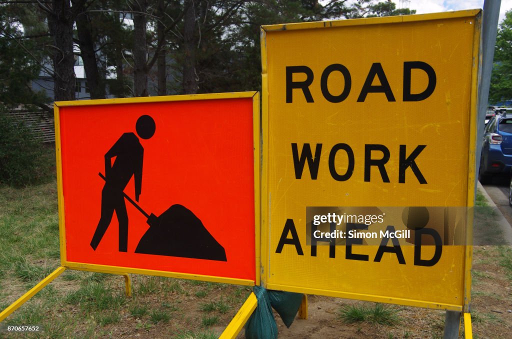 Signs indicating roadwork ahead