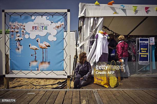 Woman takes a break at the Almeerder beach in Almere, during her visit at the Libelle Summer Week , on May 11, 2009. Visitors of this annual fair,...