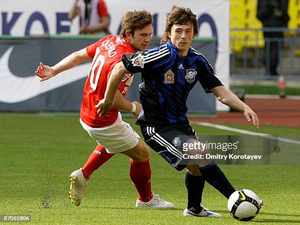 Leonid Kovel of Saturn Moscow Oblast in action against Ivan Saenko of Spartak Moscow during the Russian Premier League match between FC Spartak...