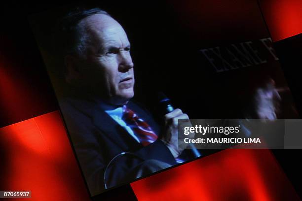 Nobel Prize for Economy laureate Edward Prescott appears on a giant screen as he addresses a seminar with two other prize winners, Joseph Stiglitz in...