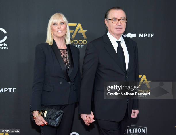 Model Janice Pennington and Hollywood Film Awards founder Carlos de Abreu attend the 21st Annual Hollywood Film Awards at The Beverly Hilton Hotel on...