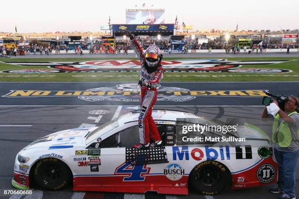 Kevin Harvick, driver of the Mobil 1 Ford, celebrates winning the Monster Energy NASCAR Cup Series AAA Texas 500 at Texas Motor Speedway on November...