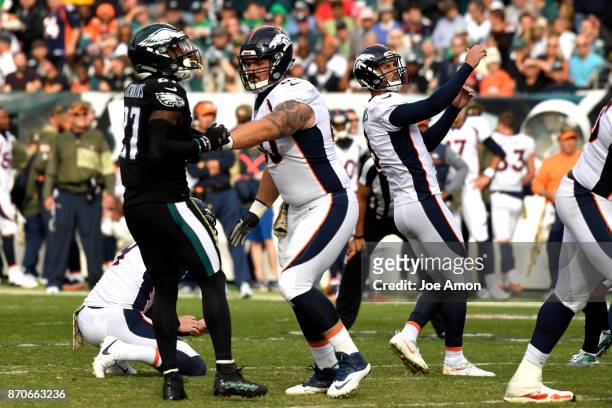 Denver Broncos kicker Brandon McManus watches the ball through the uprights in the first half as the Denver Broncos lose 51-23 to the Philadelphia...