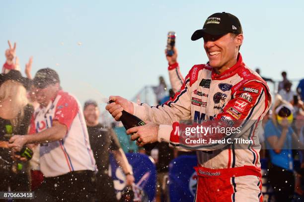 Kevin Harvick, driver of the Mobil 1 Ford, celebrates in Victory Lane after winning the Monster Energy NASCAR Cup Series AAA Texas 500 at Texas Motor...