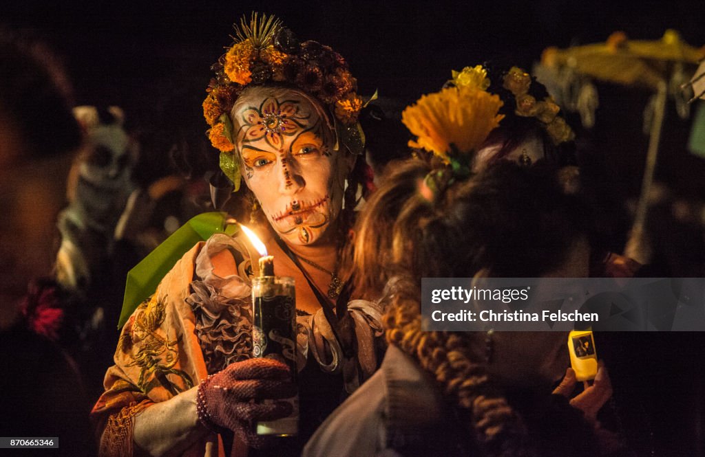 Woman commemorating the ancestors on the Day of the Dead celebration