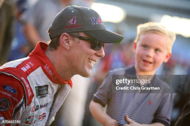 Kevin Harvick, driver of the Mobil 1 Ford, celebrates in Victory Lane after winning the Monster Energy NASCAR Cup Series AAA Texas 500 at Texas Motor...