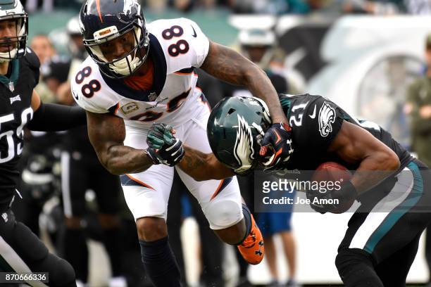 Philadelphia Eagles cornerback Patrick Robinson gets an early interception from Denver Broncos wide receiver Demaryius Thomas in the first half as...