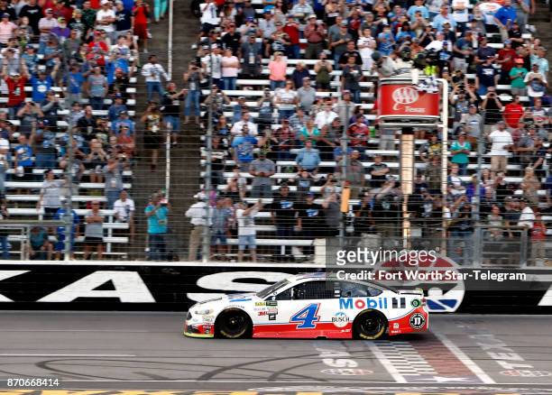 Kevin Harvick crosses the finish line, winning the Texas AAA 500 at Texas Motor Speedway on Sunday, Nov. 5, 2017. Harvick took the lead in the last...