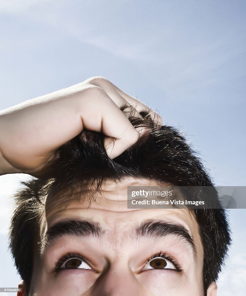 Man pulling his hair
