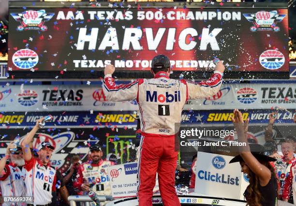 Kevin Harvick, driver of the Mobil 1 Ford, celebrates in Victory Lane after winning the Monster Energy NASCAR Cup Series AAA Texas 500 at Texas Motor...