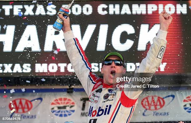 Kevin Harvick, driver of the Mobil 1 Ford, celebrates in Victory Lane after winning the Monster Energy NASCAR Cup Series AAA Texas 500 at Texas Motor...