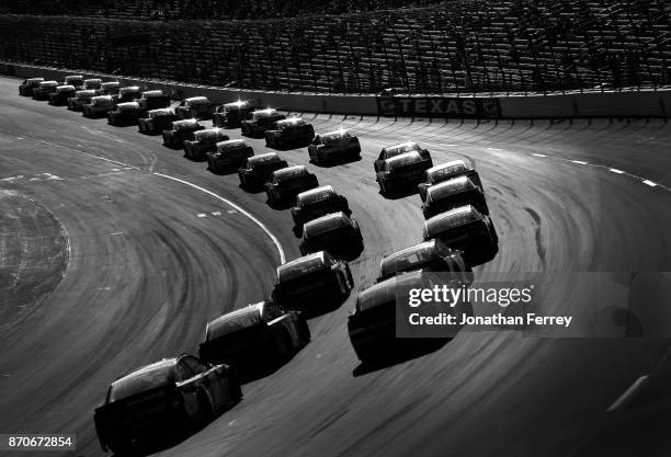 Pack of cars races during the Monster Energy NASCAR Cup Series AAA Texas 500 at Texas Motor Speedway on November 5, 2017 in Fort Worth, Texas.