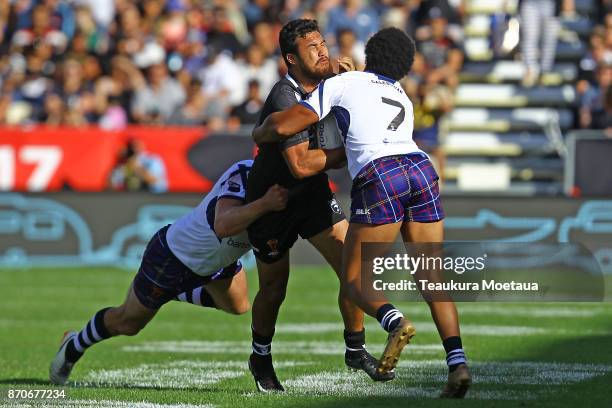 Peta Hiku of New Zealand is tackled during the 2017 Rugby League World Cup match between the New Zealand Kiwis and Scotland at AMI Stadium on...