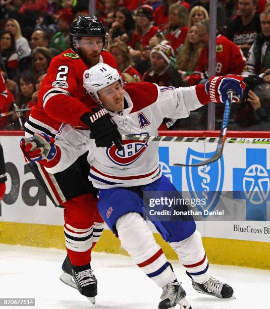 Duncan Keith of the Chicago Blackhawks pressures Brendan Gallagher of the Montreal Canadiens at the United Center on November 5, 2017 in Chicago,...