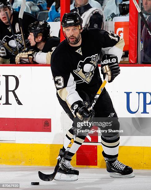 Bill Guerin of the Pittsburgh Penguins looks to pass against the Washington Capitals during Game Four of the Eastern Conference Semifinals of the...