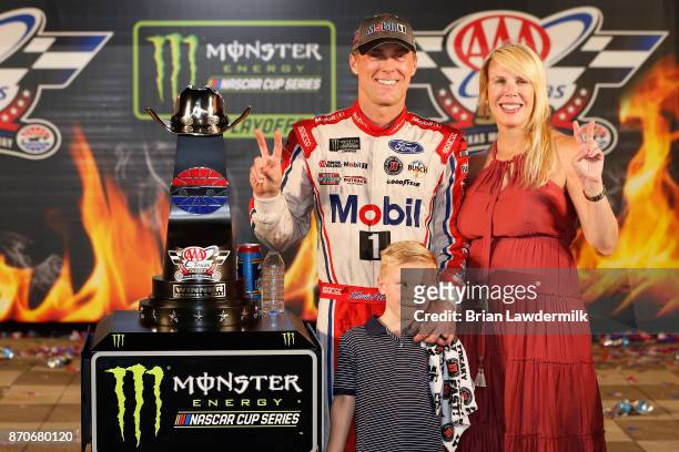 Kevin Harvick, driver of the Mobil 1 Ford, poses with his wife, Delana, and their son, Keelan, in Victory Lane after winning the Monster Energy...