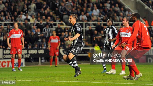 Newcastle United's Peter Lovenkrands watches as he scores their third goal against Middlesbrough during their English Premier League football match...