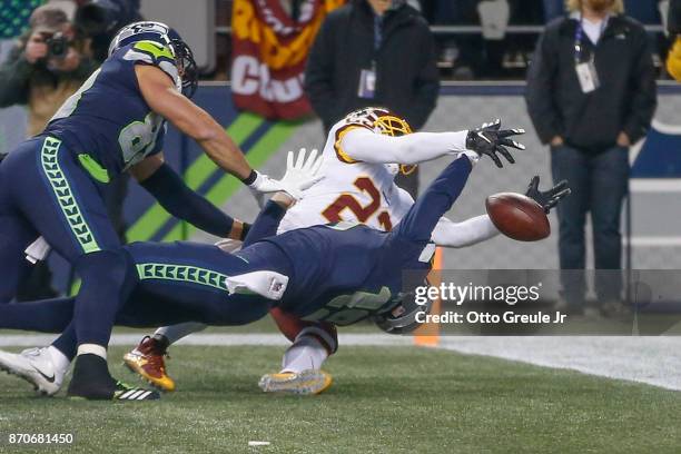 Wide receiver Tanner McEvoy of the Seattle Seahawks can't make the catch in the end zone on the final play of the game as safety DeAngelo Hall of the...