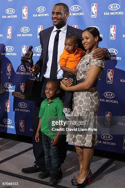 LeBron James of the Cleveland Cavaliers poses for a photo with sons LeBron Jr. And Bryce and their mother Savannah Brinson after he was named the NBA...