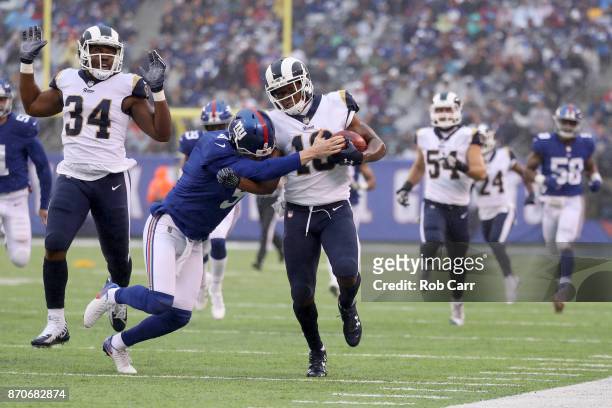 Punter Brad Wing of the New York Giants tackles Pharoh Cooper of the Los Angeles Rams on a punt return at MetLife Stadium on November 5, 2017 in East...
