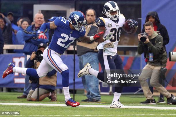 Darian Thompson of the New York Giants pushes Todd Gurley of the Los Angeles Rams out of bounds in the first half at MetLife Stadium on November 5,...