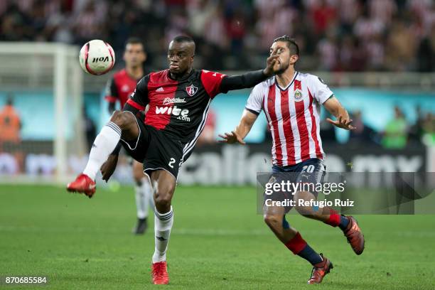 Rodolfo Pizarro of Chivas fights for the ball with Jaine Barreiro of Atlas during the 16th round match between Chivas and Atlas as part of the Torneo...