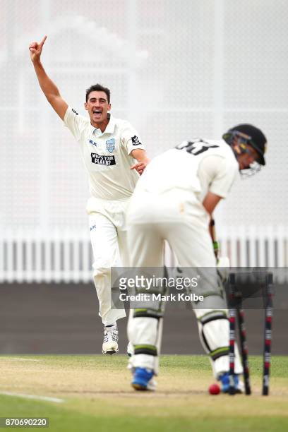 Mitchell Starc of the Blues celebrates bowling Simon Mackin of the Warriors to take a hat-trick during day three of the Sheffield Shield match...