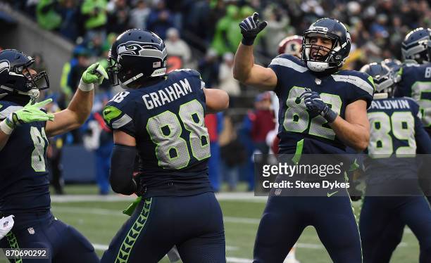 Tight end Luke Willson of the Seattle Seahawks celebrates with teammates after scoring a touchdown during the fourth quarter of the game against the...