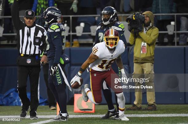 Wide receiver Josh Doctson of the Washington Redskins reacts after making a catch near the goal line as defensive back Bradley McDougald and...