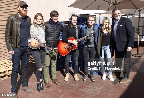 Eric Paslay, Emma Salute, Dave Barnes, Dawson Anderson, Hunter Hayes, Maddie Salute, and Erick Long of the Academy of Country Music pose during Live...