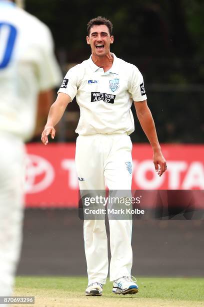 Mitchell Starc of the Blues celebrates trapping David Moody of the Warriors LBW to claim the second of his three wickets in his hat-trick during day...
