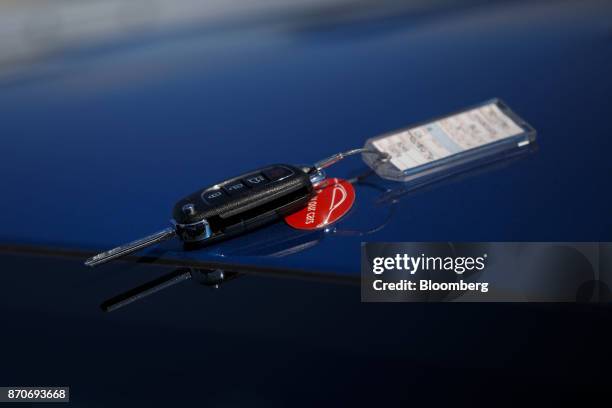 Set of rental vehicle keys sits on a vehicle at an Avis Budget Group Inc. Location at Los Angeles International Airport in Los Angeles, California,...