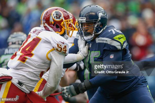 Offensive tackle Duane Brown of the Seattle Seahawks pass blocks against linebacker Mason Foster of the Washington Redskins at CenturyLink Field on...
