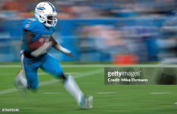 Jakeem Grant of the Miami Dolphins returns a kick during a game against the Oakland Raiders at Hard Rock Stadium on November 5, 2017 in Miami...