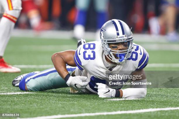 Dallas Cowboys wide receiver Terrance Williams crawls on the field after a first down catch during the NFL football game between the Dallas Cowboys...