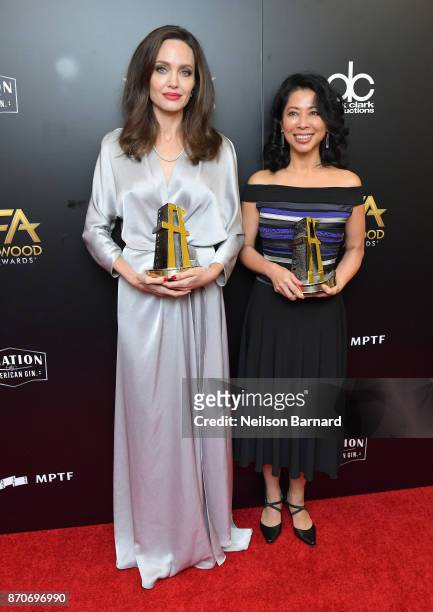 Honorees Angelina Jolie and Loung Ung, recipients of the Hollywood Foreign Language Film Award for 'First They Killed My Father,' pose in the press...