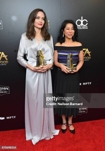 Honorees Angelina Jolie and Loung Ung, recipients of the Hollywood Foreign Language Film Award for 'First They Killed My Father,' pose in the press...