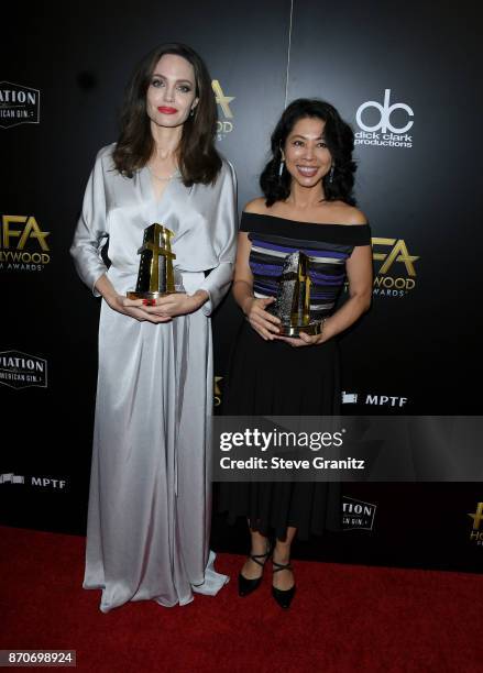 Honorees Angelina Jolie and Loung Ung, recipients of the Hollywood Foreign Language Film Award for 'First They Killed My Father,' pose in the press...