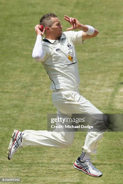 Peter Siddle of Victoria bowls during day three of the Sheffield Shield match between Victoria and South Australia at Melbourne Cricket Ground on...