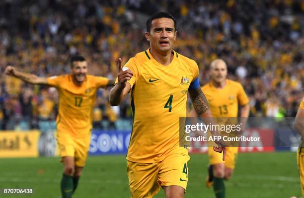File photo taken on October 10 shows Tim Cahill of Australia celebrating with teammates after scoring against Syria during their 2018 World Cup...