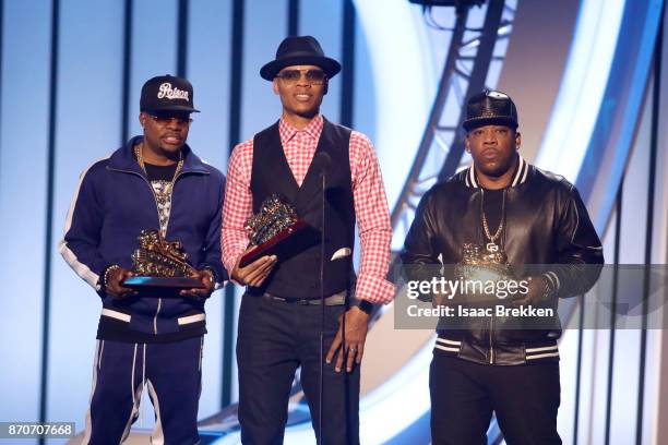 Michael Bivins, Ricky Bell, and Ronnie DeVoe of Bell Biv DeVoe present the Lady of Soul Award onstage at the 2017 Soul Train Awards, presented by...