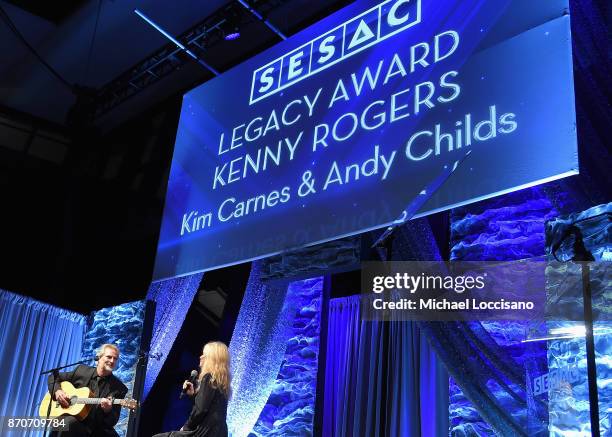 Singer-songwriters Andy Childs and Kim Carnes perform onstage during 2017 SESAC Nashville Music Awards on November 5, 2017 in Nashville, Tennessee.