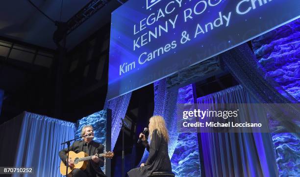 Singer-songwriters Andy Childs and Kim Carnes perform onstage during 2017 SESAC Nashville Music Awards on November 5, 2017 in Nashville, Tennessee.